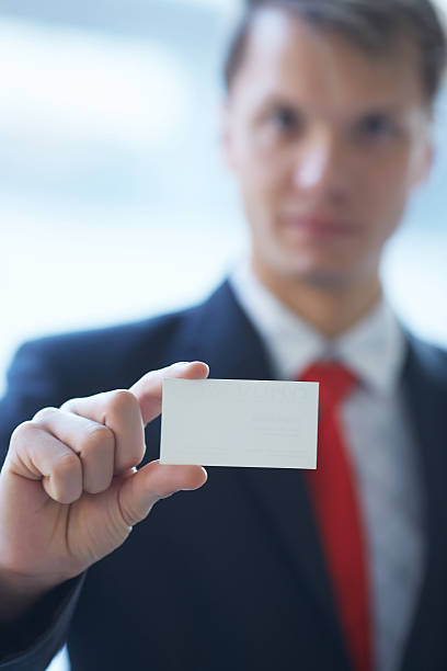 istock businessman giving a business card 481618634