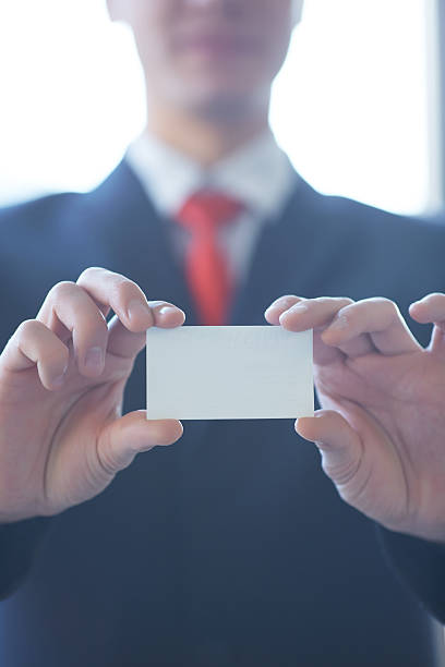 istock businessman giving a business card 481618646