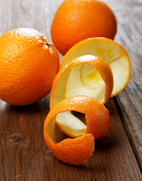 istock Oranges and dried peel on a rural table 481618688