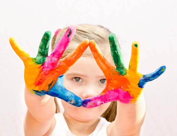 istock Cute little girl with hands in paint 481618997