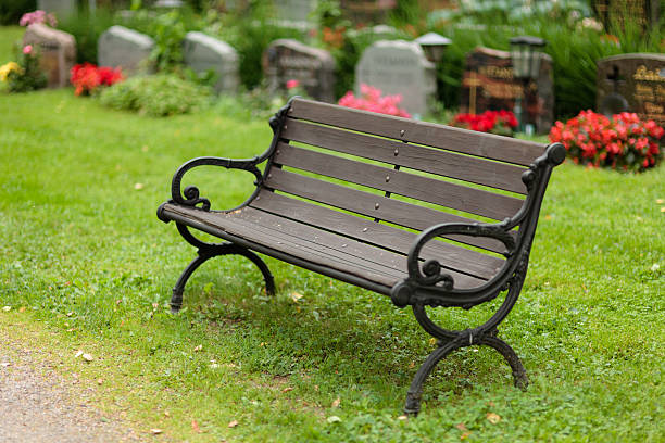 istock Empty old wooden bench in cemetery 481619004