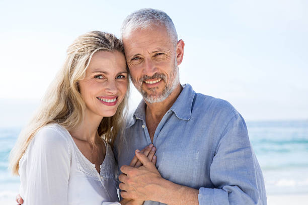 istock Happy couple hugging each other and looking at camera 481619152