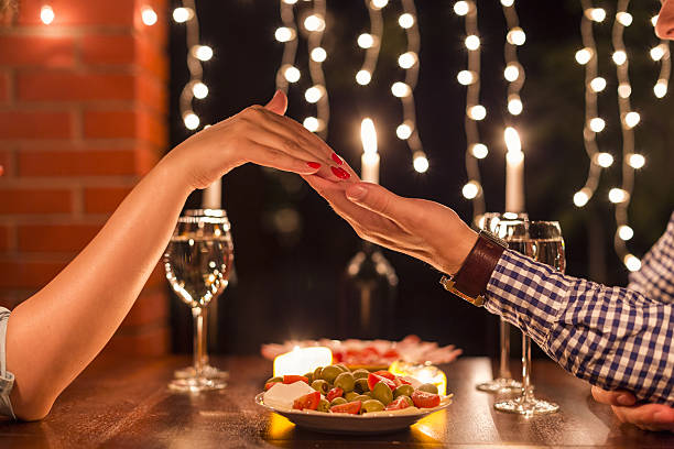 istock Young couple with a romantic dinner with candles. 481622196