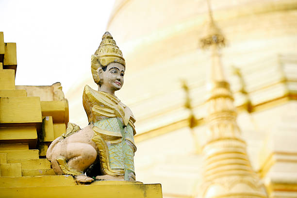 Angel sculpture at Shwedagon pagoda in Yangon, Myanmar. stock photo