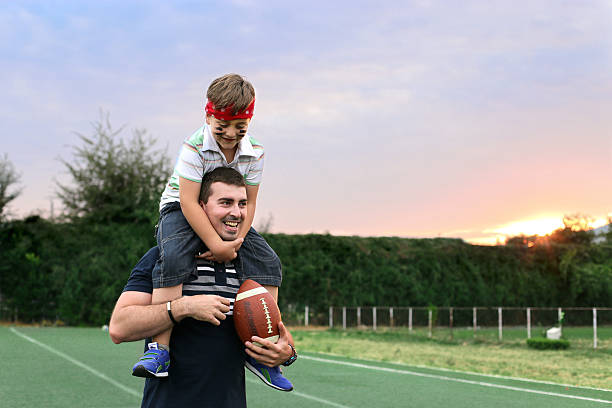 istock Father Carrying His Son On His Shoulders 481622782