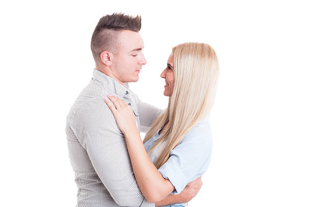 istock Happy young couple hugging and looking at each other 481625382