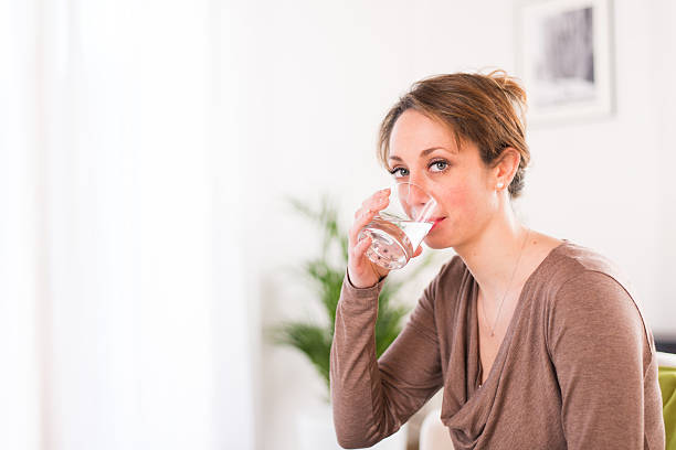 istock cheerful young women drinking mineral water 481626511
