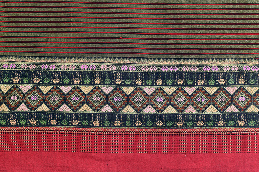 Colorful Thailand style rug surface close up vintage fabric is made of hand-woven cotton fabricColorful Thailand style rug surface close up vintage fabric is made of hand-woven cotton fabric