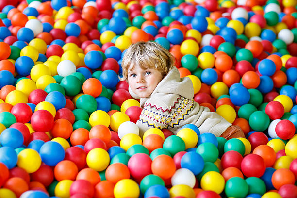 istock child playing at colorful plastic balls playground 481629776