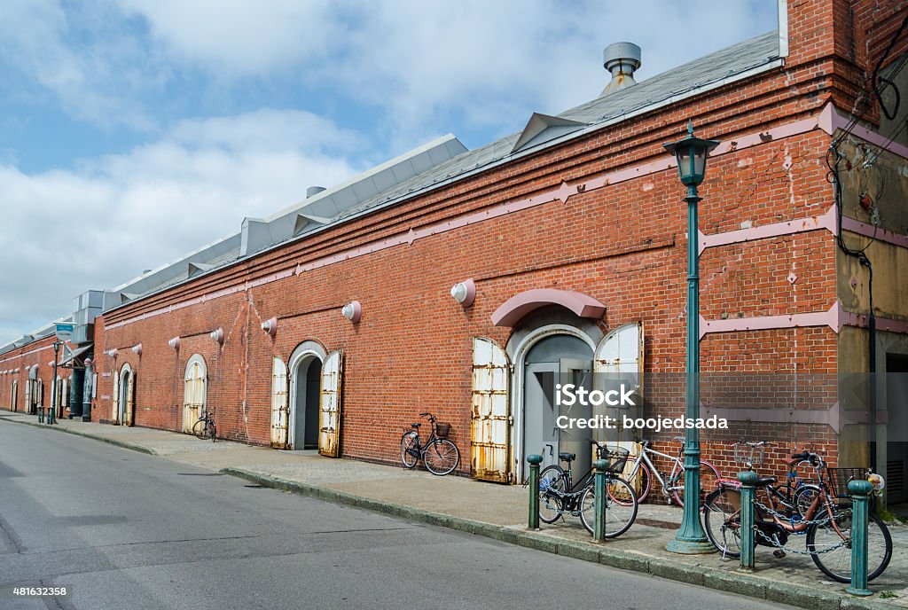 Red brick warehouse with bicycles Red brick warehouse with bicycles in Hakodate city , port city of Hokkaido , Japan. Hakodate Stock Photo