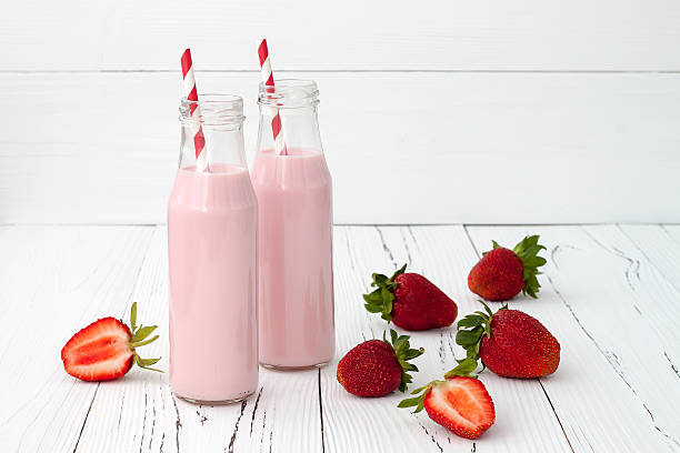 istock Strawberry milk in traditional glass bottles 481632846