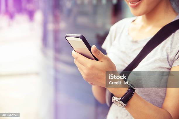 Young Asian Woman Use Smartphone At City Stock Photo - Download Image Now - 2015, Adult, Adults Only