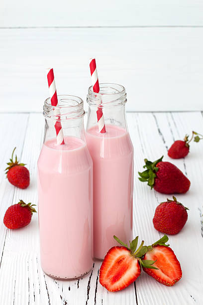 istock Strawberry milk in traditional glass bottles 481632932