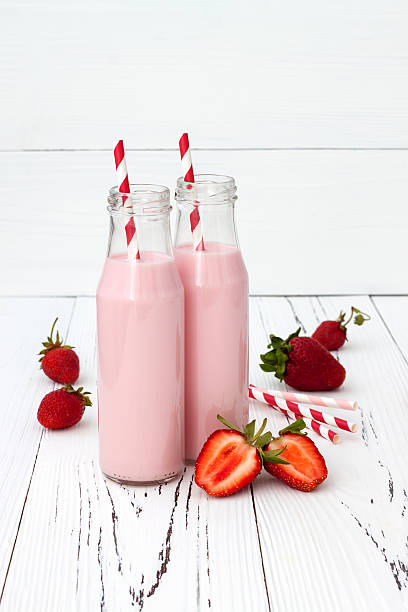 istock Strawberry milk in traditional glass bottles 481632942