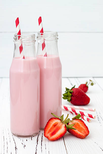 istock Strawberry milk in traditional glass bottles 481633016