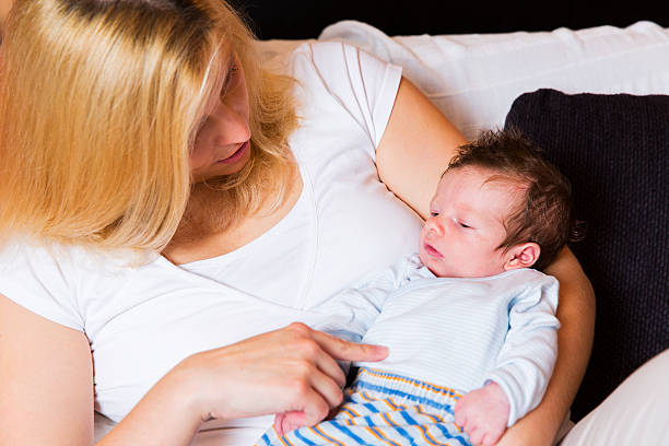 istock Young mother and newborn resting on her chest 481633876
