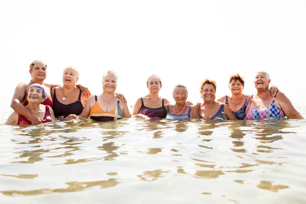 istock Mature ladies laughing on beach 481634202