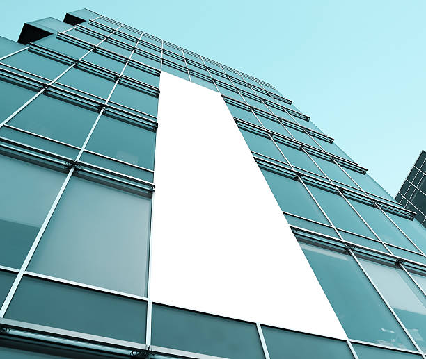 istock blue glass wall with blank placard of skyscraper 481634495