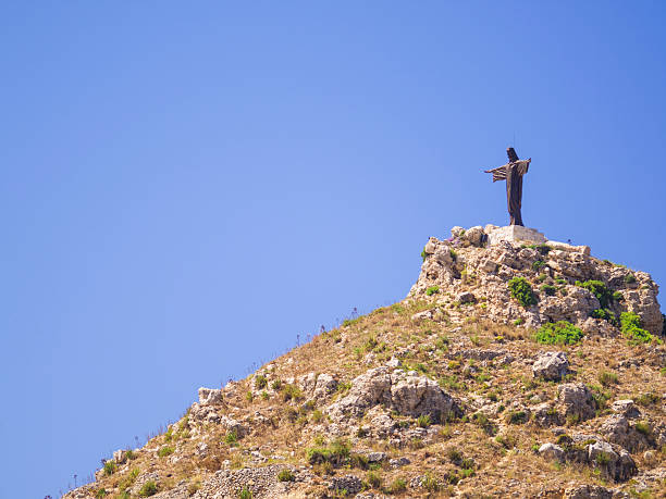 Jesus Christ statue standing on the top of hill between Victoria the capital town of Gozo and the Marsalforn a seaside resort on north east cost of Island Gozo. It is like a small Rio de Janeiro's one,  Malta.