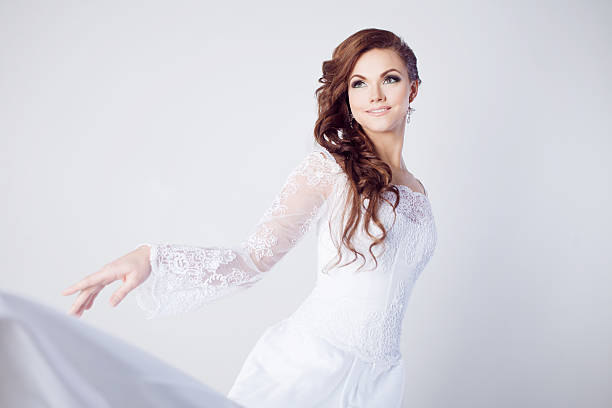 istock Beautiful bride in wedding dress, white background, close up 481635332