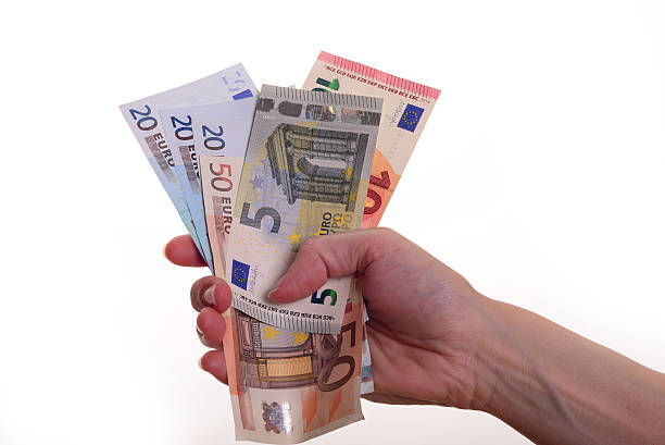 istock woman holding euro money 481635842