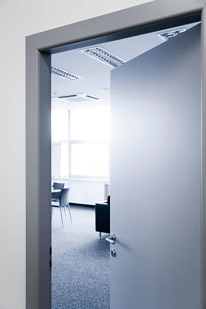 istock Open office door window chairs and carpet 481636392
