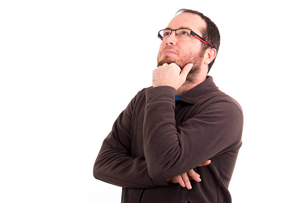 istock portrait of thoughtful young man looking up isolated 481636520