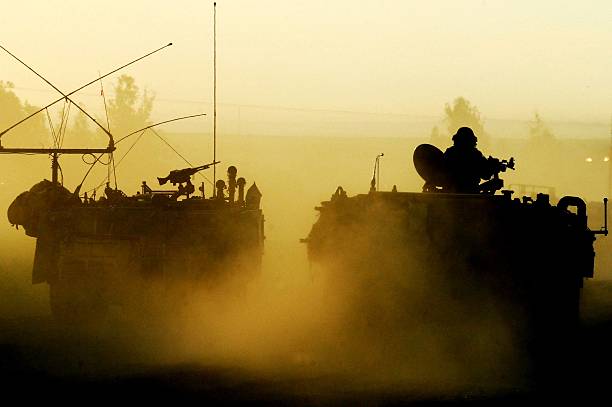 Silhouette Army Soldier Sunset Israeli Army troops on the Israel-Gaza border are entering in and out from Gaza Strip to renew forces on Wednesday, January 14, 2009 The Israeli defense ground forces progressed slowly into Gaza city to prevent civilian casualties. On Tuesday, the IDF pushed deeper into Gaza City and launched pinpoint raids in the southern Strip as Defense Minister Ehud Barak announced that his top aide would head to Cairo to try to secure a cease-fire that could end Operation Cast Lead. palestinian territories stock pictures, royalty-free photos & images