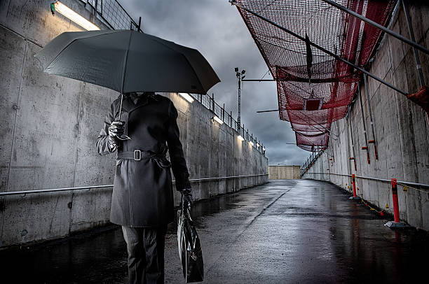 istock Businessman holding black umbrella on rainy day 481638957