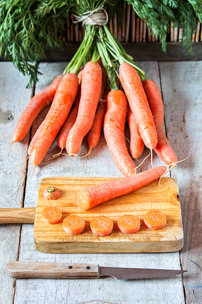 istock Fesh carrots on grungy wooden background 481641254