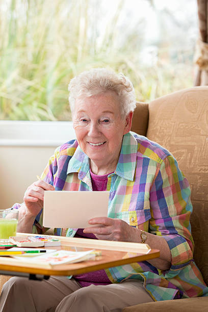 istock Senior Woman Painting 481642665