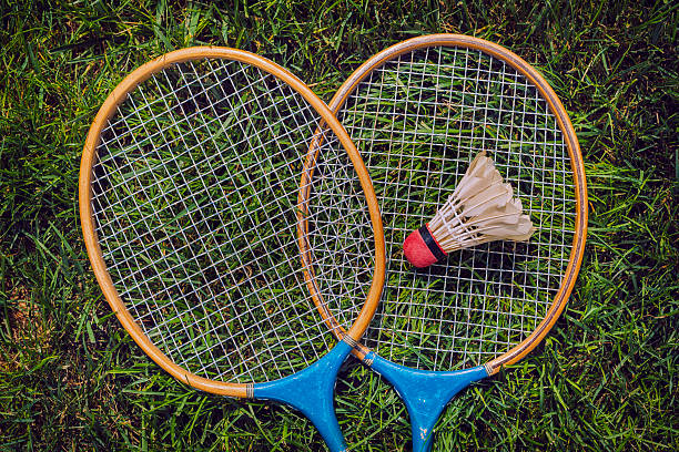 istock Vintage badminton rackets and shuttlecock lying in grass 481643982