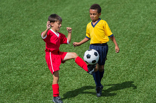 istock Two Young Boys Playing Football 481645091
