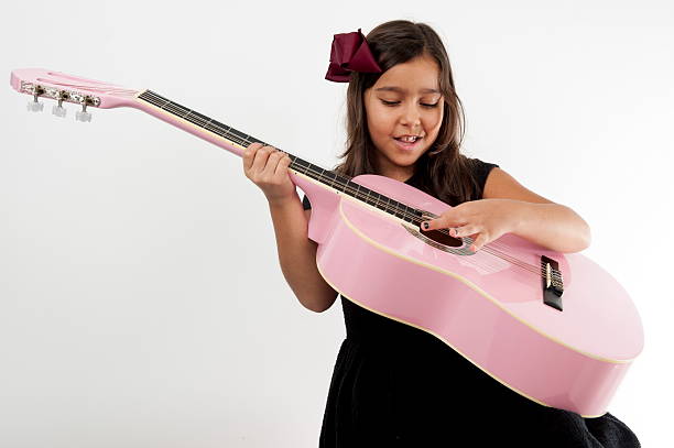 istock Girl playing guitar and sing 481645124
