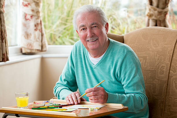 istock Senior Man Painting 481646395