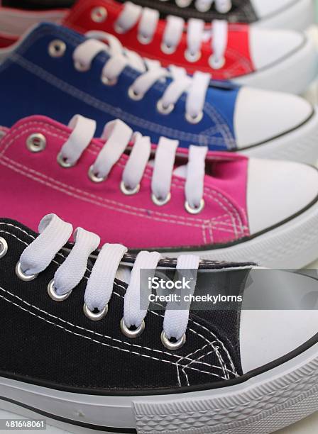 Row Of Baseball Boots Sneakers With Laces In Different Colors Stock Photo - Download Image Now