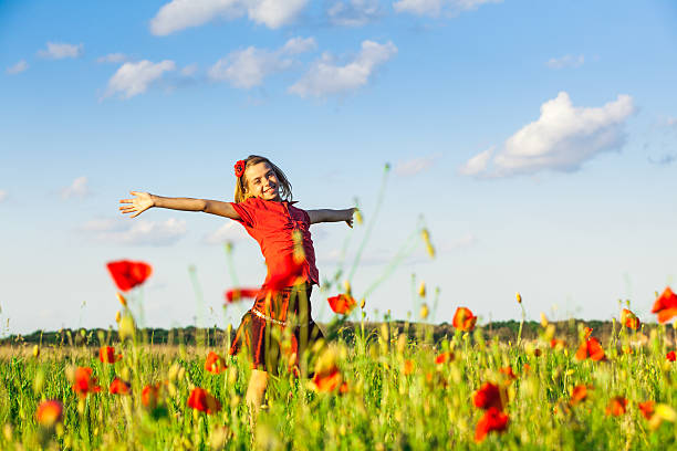 istock Girl in poppies 481652958