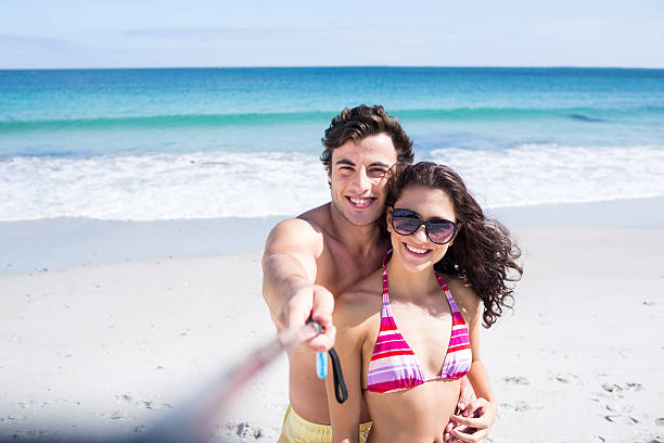 istock Happy couple taking selfie with stick 481653522