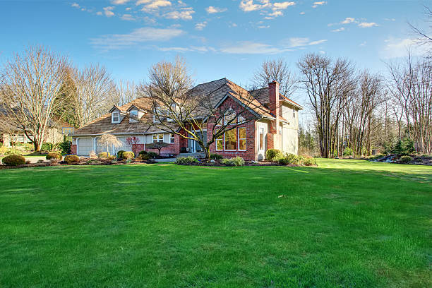 istock American traditional home with large driveway. 481653946
