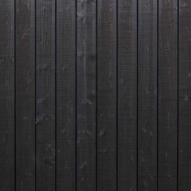 istock vertical black planks on wooden part of building 481656366