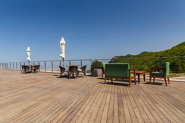 istock Holiday tables, chairs, a sofa and closed umbrellas 481657100