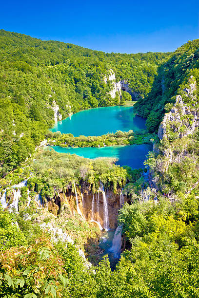 Beautiful falling lakes of Plitvice national park Beautiful falling lakes of Plitvice national park vertical view, Croatia plitvice lakes national park stock pictures, royalty-free photos & images