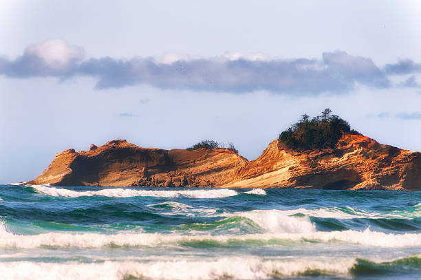 Sandstone hills jut out into the ocean