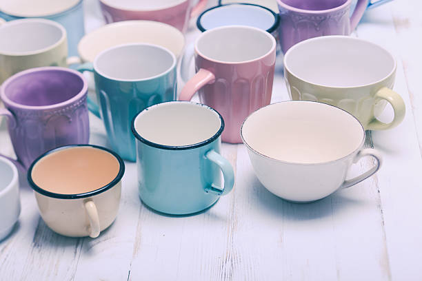 The cups The cups in shabby chic style, vintage colors enamel teapot stock pictures, royalty-free photos & images
