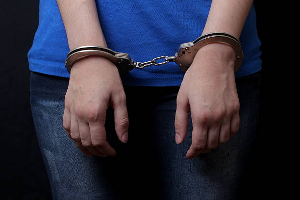 istock handcuffed the woman 481665614