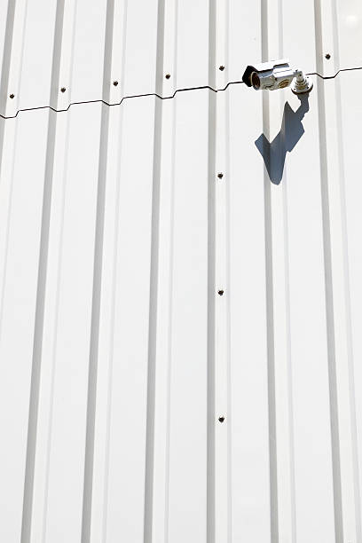 istock surveillance camera on wall of industrial building 481666068