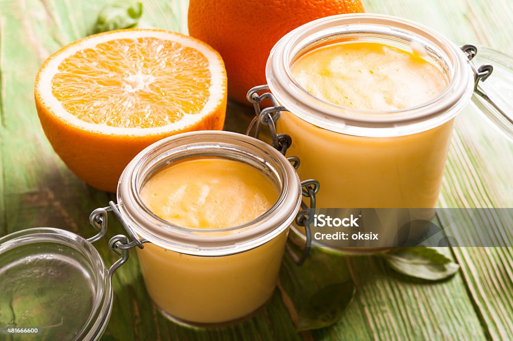 Orange curd Orange curd in glass jars on the table 2015 Stock Photo