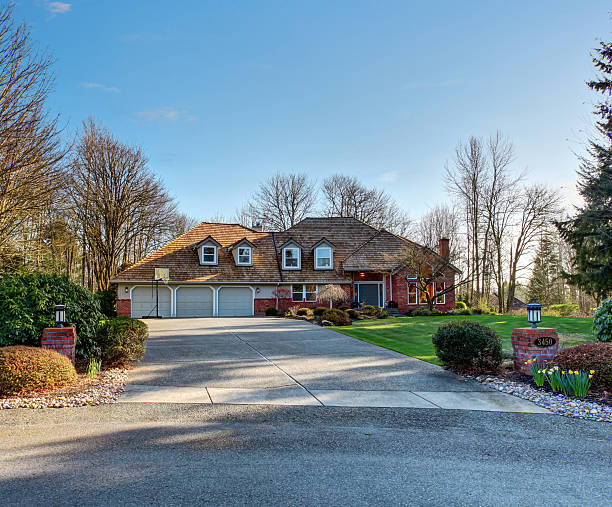 istock American traditional home with large driveway. 481670260