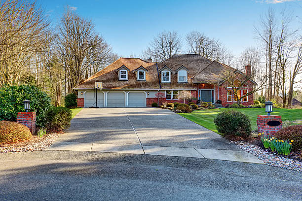 istock American traditional home with large driveway. 481670262