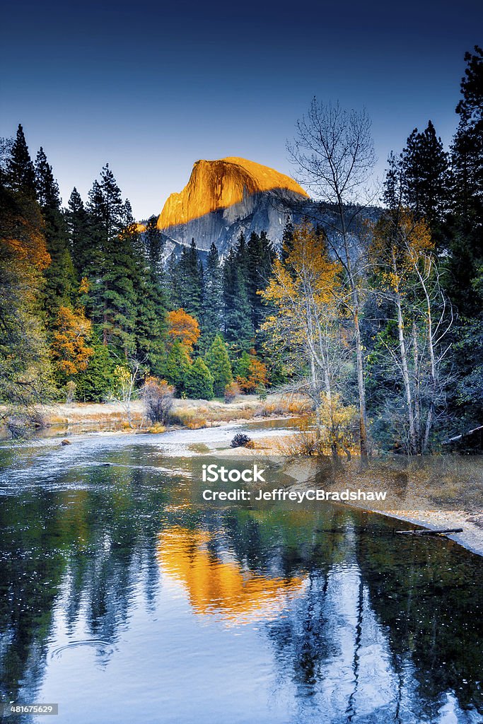 Half Dome Reflection Half Dome reflected in the Merced river on an autumn afternoon. Yosemite National Park Stock Photo